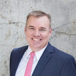 professional headshot of Darren W. Hatch, smiling white man with blonde hair