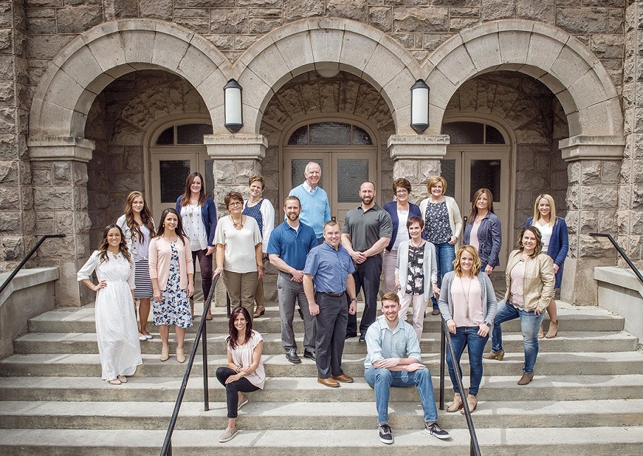 group of people in casual grouping outdoors on stairs